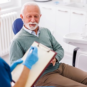 a dentist consulting with a patient about dental implants