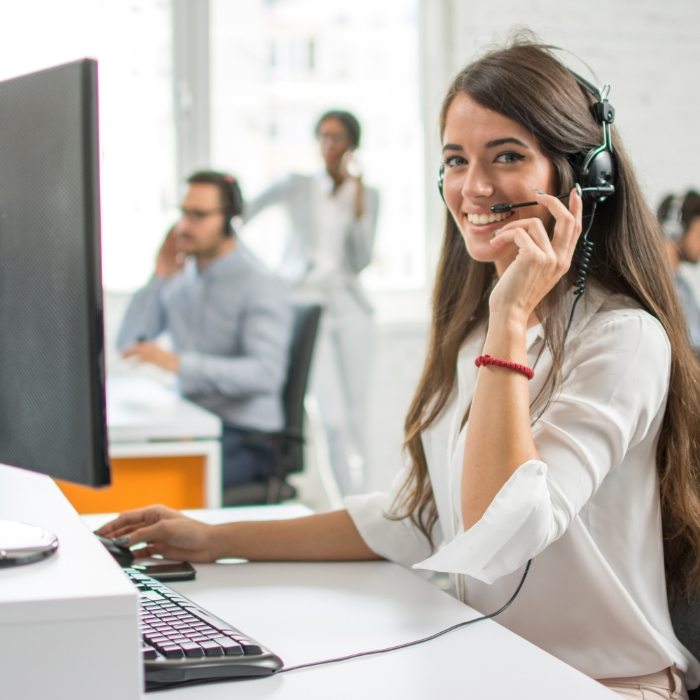 Smiling dental team member with phone headset