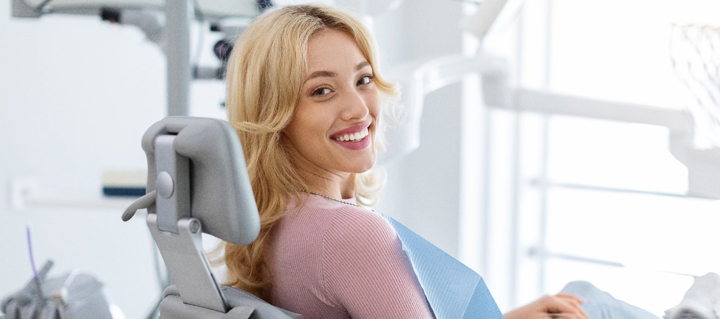Blonde female patient looking back and smiling