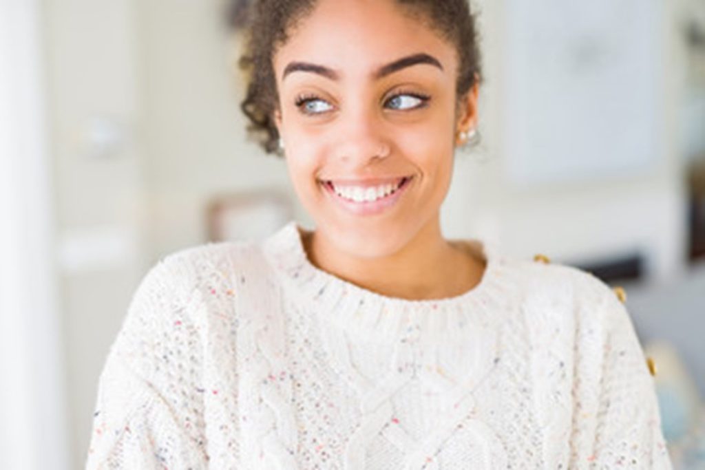 person smiling after getting dental implants